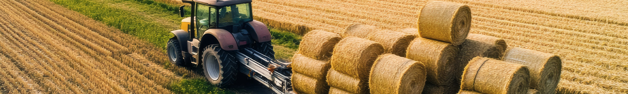 Tractor operating in a harvested agricultural field